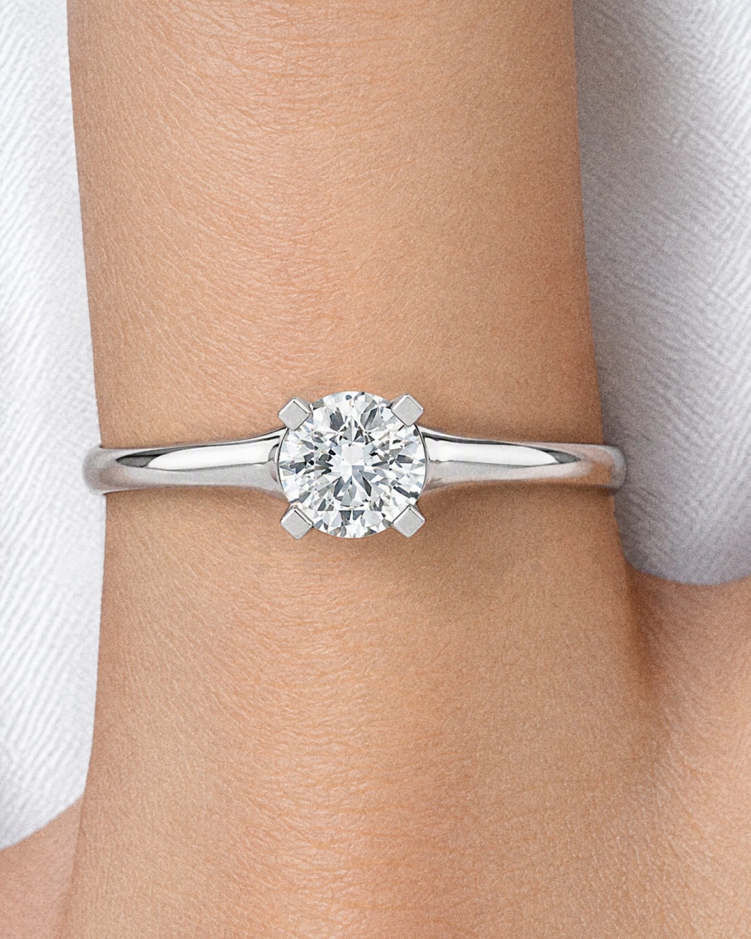 Classic Solitaire Ring, white stone, rhodium finish, worn