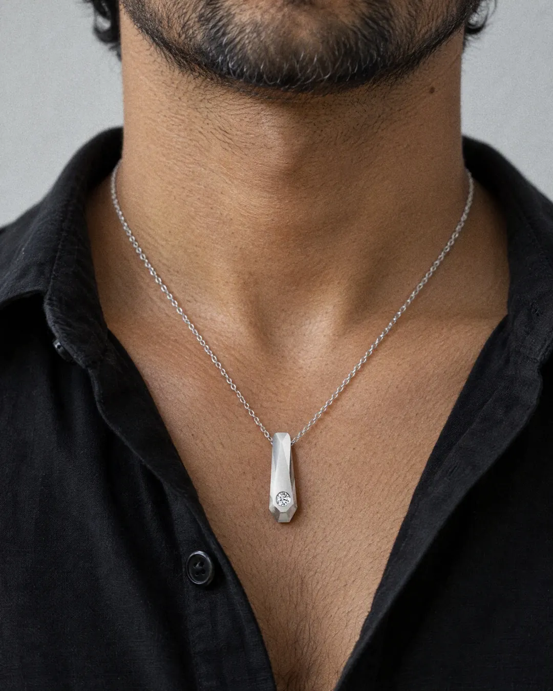 Facetta Solitaire Pendant, white stone, rhodium finish, worn