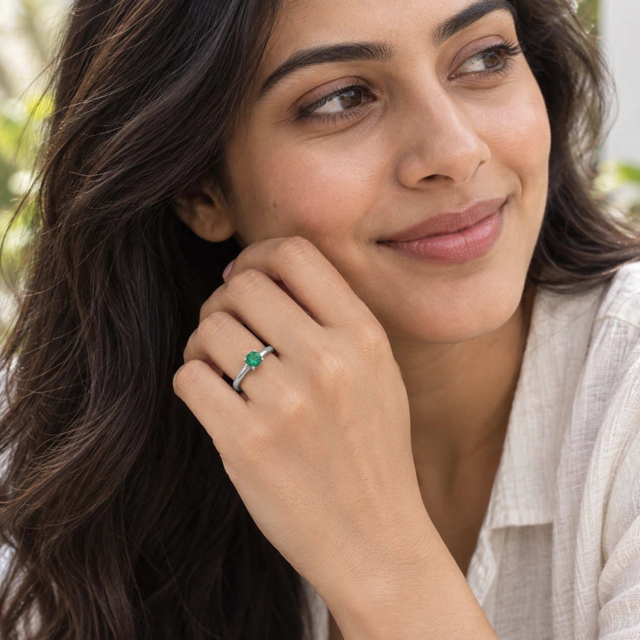 Classic Solitaire Ring, green stone, rhodium finish — worn close