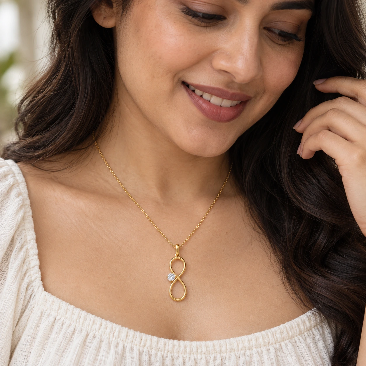 Infinity Solitaire Pendant, white stone, gold finish — worn close